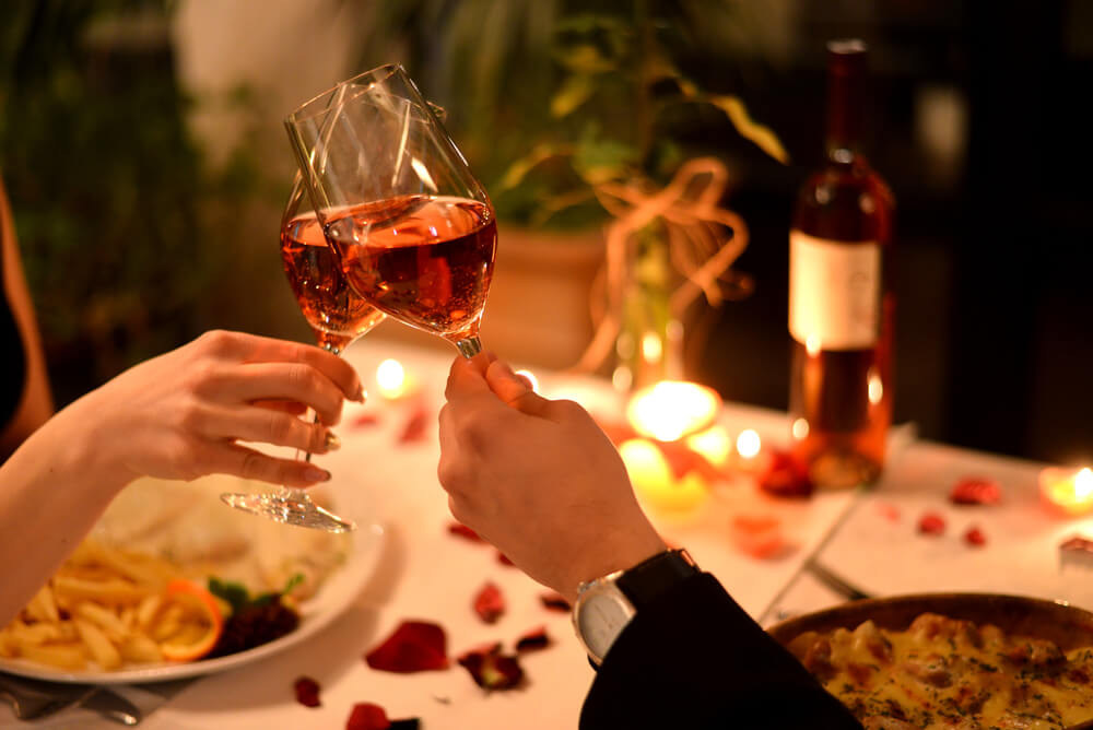 Romantic dinner with wine glasses during a couples getaway in Wisconsin Dells